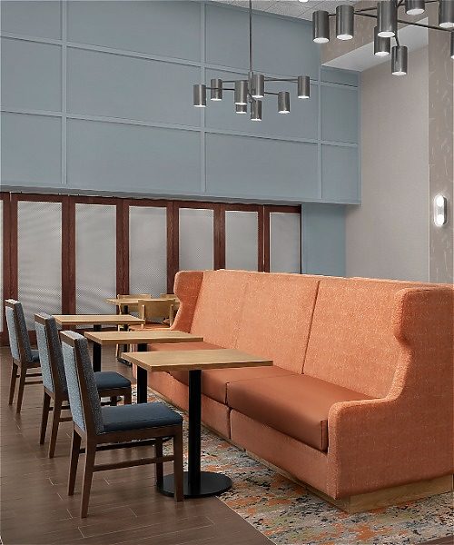 Hotel dining amenities with booth tables and chairs